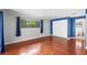 Bright bedroom with hardwood floors and large window at 9605 Hollyglen Pl, Windermere, FL 34786