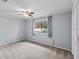 Bedroom with gray walls, carpet, and ceiling fan at 9605 Hollyglen Pl, Windermere, FL 34786