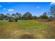 Community green space with tennis courts and playground at 9605 Hollyglen Pl, Windermere, FL 34786