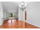 Bright dining room with hardwood floors and chandelier at 9605 Hollyglen Pl, Windermere, FL 34786