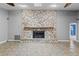 Stone fireplace in living room with tile hearth at 9605 Hollyglen Pl, Windermere, FL 34786