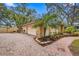 Attached garage with paver driveway and landscaping at 9605 Hollyglen Pl, Windermere, FL 34786