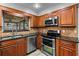 Stylish kitchen with stainless steel appliances and granite countertops at 9605 Hollyglen Pl, Windermere, FL 34786