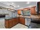 Modern kitchen with granite countertops and stainless steel appliances at 9605 Hollyglen Pl, Windermere, FL 34786