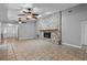 Living room with tile floors and a large stone fireplace at 9605 Hollyglen Pl, Windermere, FL 34786