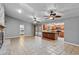 Open concept living room with kitchen and pool view at 9605 Hollyglen Pl, Windermere, FL 34786