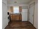Functional kitchen features wood cabinets, white appliances, and a practical layout at 10094 Sw 153Rd Ln, Dunnellon, FL 34432