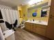 Clean bathroom with double vanity and updated fixtures at 1017 Willow Dr, Leesburg, FL 34748