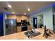 Updated kitchen featuring stainless steel appliances and a breakfast bar at 1017 Willow Dr, Leesburg, FL 34748