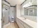 Bathroom with shower, vanity, and plaid wallpaper at 10476 Se 178Th St, Summerfield, FL 34491