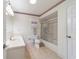 Bathroom features a bathtub and double vanity at 10476 Se 178Th St, Summerfield, FL 34491