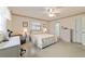 Bright bedroom with carpeted floor and a double bed at 10476 Se 178Th St, Summerfield, FL 34491