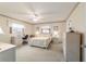 Spacious bedroom with carpeted floor, double bed, and built-in desk at 10476 Se 178Th St, Summerfield, FL 34491