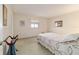 Bright bedroom with carpeted floor and a queen bed at 10476 Se 178Th St, Summerfield, FL 34491