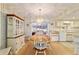 Bright dining area with wooden table and chairs, and a built-in hutch at 10476 Se 178Th St, Summerfield, FL 34491