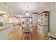Dining area with a round table, white chairs, and built-in hutch at 10476 Se 178Th St, Summerfield, FL 34491