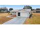 Single story home with attached garage and landscaped yard at 10476 Se 178Th St, Summerfield, FL 34491