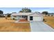 Single story home with attached garage and small front porch at 10476 Se 178Th St, Summerfield, FL 34491