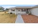 House front entry with walkway and small porch at 10476 Se 178Th St, Summerfield, FL 34491