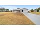 Single-story home with attached garage and front yard at 10476 Se 178Th St, Summerfield, FL 34491