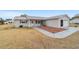 Single-story home with attached garage and front yard at 10476 Se 178Th St, Summerfield, FL 34491
