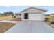 Gray single car garage with white door and screen at 10476 Se 178Th St, Summerfield, FL 34491