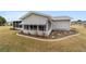 Rear view of house with screened porch at 10476 Se 178Th St, Summerfield, FL 34491