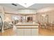 Open kitchen with island and view into living room at 10476 Se 178Th St, Summerfield, FL 34491
