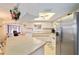 Kitchen with stainless steel refrigerator and white cabinetry at 10476 Se 178Th St, Summerfield, FL 34491