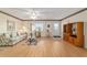 Spacious living room with light wood floors, and a view to the entryway at 10476 Se 178Th St, Summerfield, FL 34491
