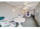 Charming sunroom with white table and chairs, great for relaxing at 10476 Se 178Th St, Summerfield, FL 34491