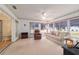 Bright sunroom with comfy seating and view of backyard at 10476 Se 178Th St, Summerfield, FL 34491