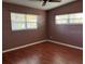 Spacious bedroom with hardwood floors and large windows at 1220 Beulah Rd, Winter Garden, FL 34787