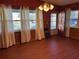 Dining room with wood paneling and hardwood floors at 1220 Beulah Rd, Winter Garden, FL 34787