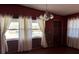 Cozy dining area with wood paneled walls and hardwood floors at 1220 Beulah Rd, Winter Garden, FL 34787