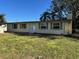 Ranch-style home with double doors and yard at 1220 Beulah Rd, Winter Garden, FL 34787