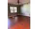 Bright living room with hardwood floors and large window at 1220 Beulah Rd, Winter Garden, FL 34787