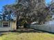 Large side yard with mature trees and privacy fence at 1220 Beulah Rd, Winter Garden, FL 34787
