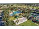 Community pool, tennis courts, and sand volleyball court at 13709 Se 89Th Ave, Summerfield, FL 34491