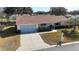 Single-story house with a two-car garage and landscaped yard at 13709 Se 89Th Ave, Summerfield, FL 34491