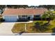 Single-story house with a screened garage and palm tree at 13709 Se 89Th Ave, Summerfield, FL 34491