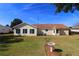 Large backyard with patio, grass, and bird bath at 13709 Se 89Th Ave, Summerfield, FL 34491