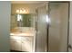 Clean bathroom with shower stall, vanity, and mirror at 13709 Se 89Th Ave, Summerfield, FL 34491