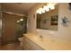Bathroom with shower, toilet and a vanity with sink at 13709 Se 89Th Ave, Summerfield, FL 34491