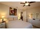 Bedroom with double bed, ceiling fan and access to other rooms at 13709 Se 89Th Ave, Summerfield, FL 34491