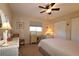 Guest bedroom with a double bed, desk, and ample closet space at 13709 Se 89Th Ave, Summerfield, FL 34491