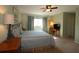 Spacious bedroom with ceiling fan and neutral color palette at 13709 Se 89Th Ave, Summerfield, FL 34491