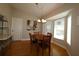 Bright breakfast nook with a round table and four chairs, featuring a large window at 13709 Se 89Th Ave, Summerfield, FL 34491
