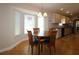 Cozy breakfast nook with a round table and chairs, situated near a large window at 13709 Se 89Th Ave, Summerfield, FL 34491