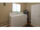 Laundry room with washer, dryer, and storage cabinet at 13709 Se 89Th Ave, Summerfield, FL 34491